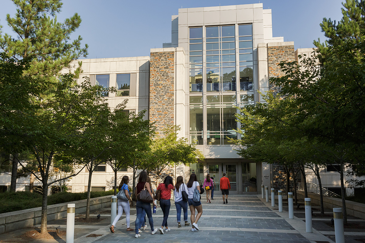 Students walking into the Fuqua School of Business