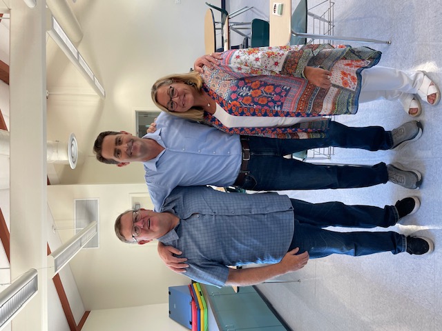 Tom, Stephanie, and the news reporter in the classroom