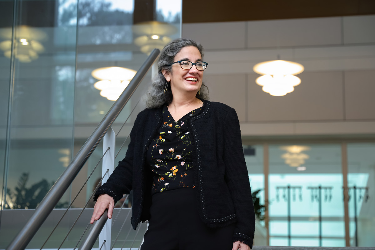 Interim Dean Mary Frances Luce standing on stairs