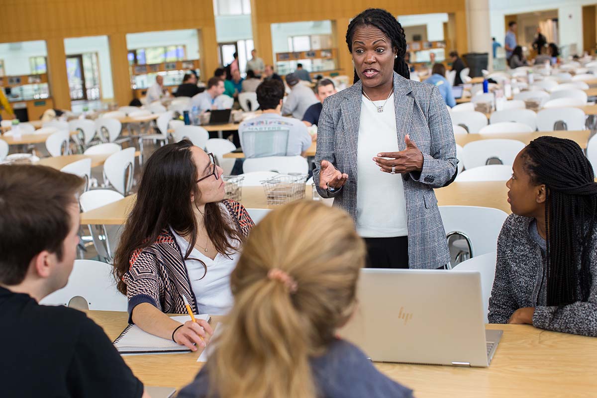 Professor Ashley Rosette talking to students in Women Leaders Program